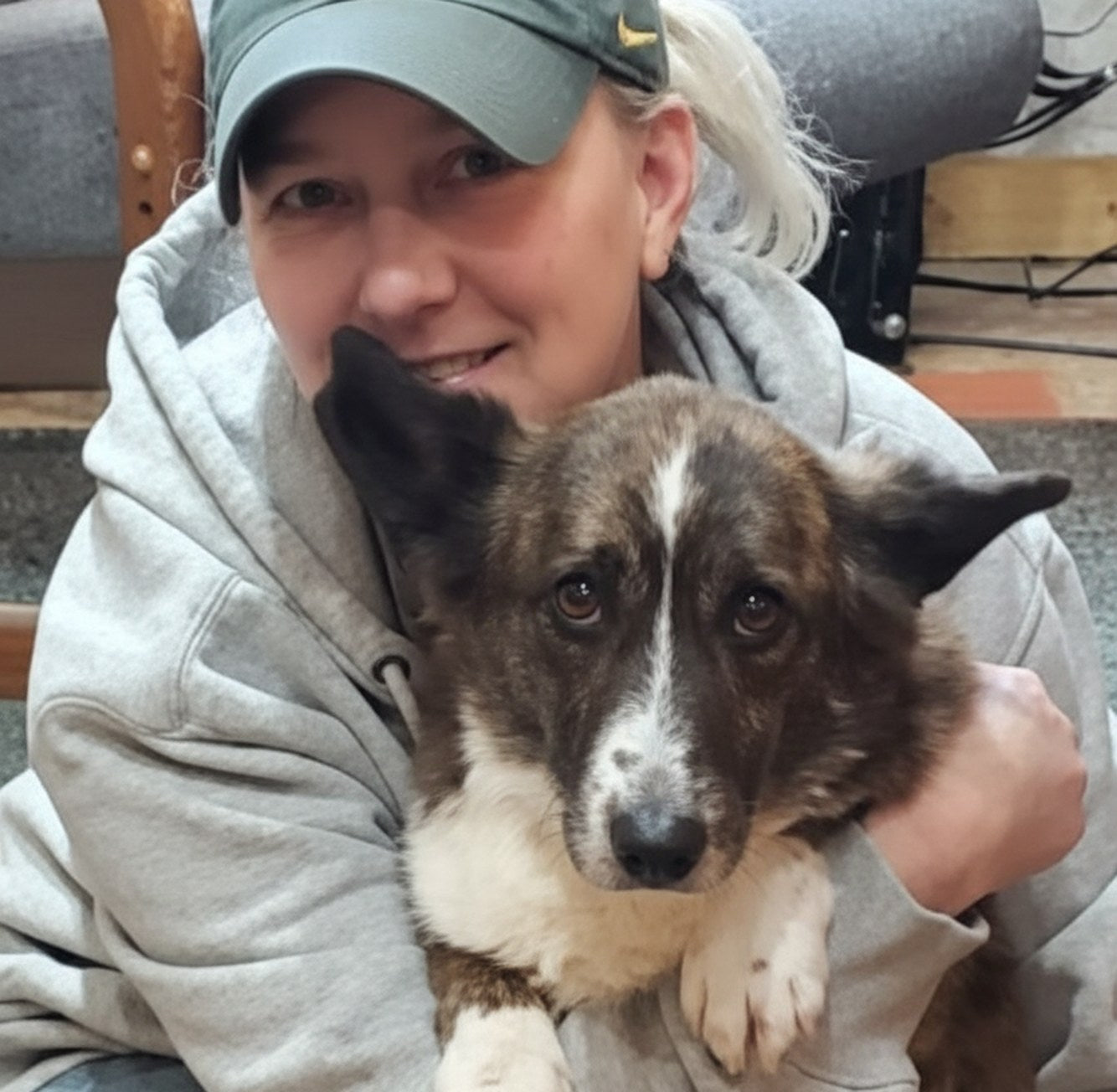 A customer holding her dog